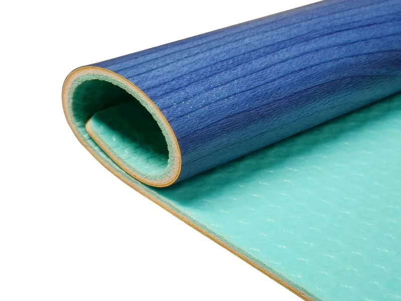 Close-up of punctured PVC flooring from dumbbell drop